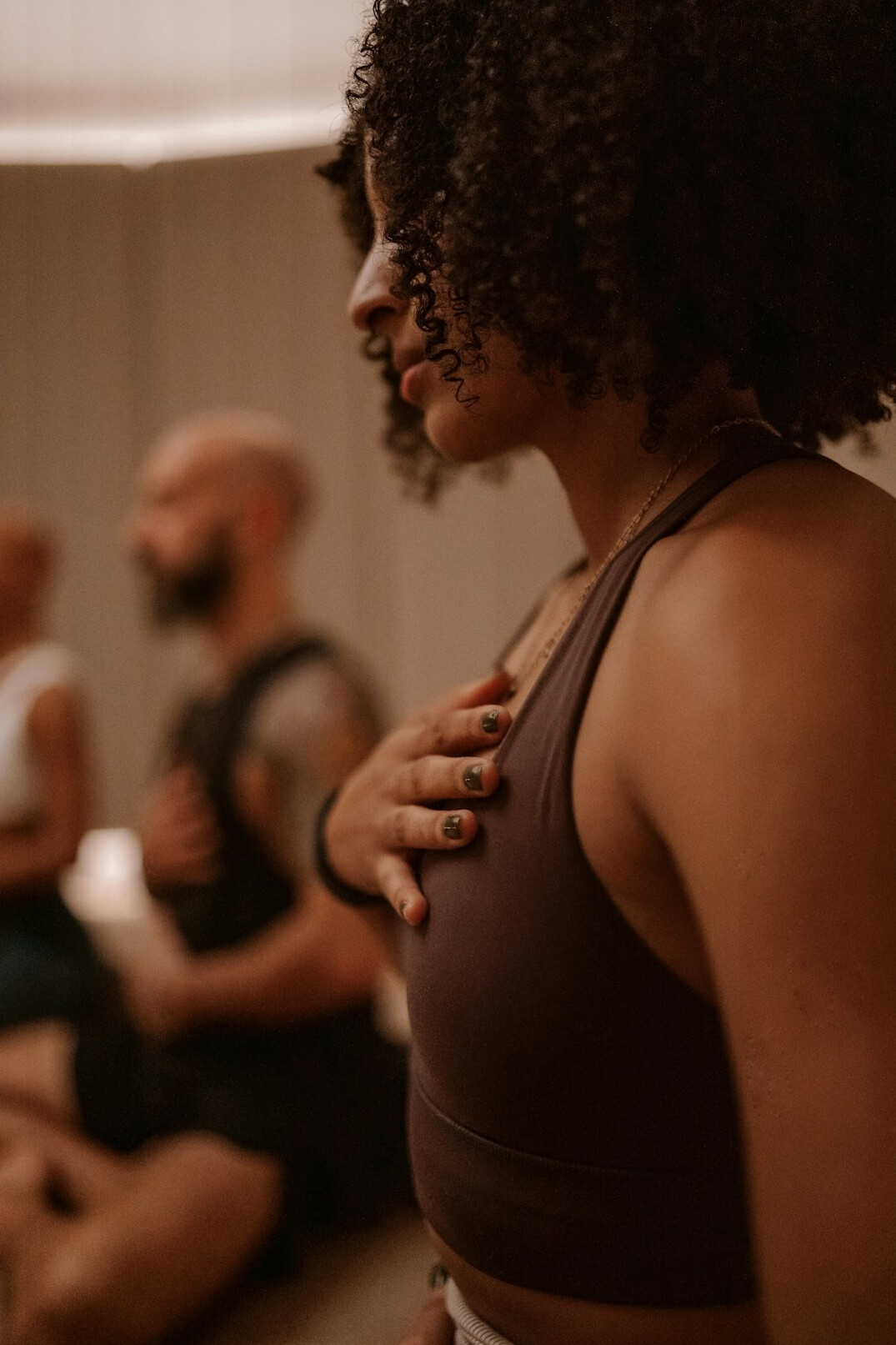 Coach guiding a breathing and voice exercise session